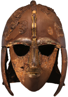 Colour photograph of the Sutton Hoo helmet, which has boar images on each of its two eyebrows