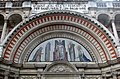 The tympanum at Westminster Cathedral showing Christ in Majesty with the Virgin Mary and Saints; a mosaic by Robert Anning Bell after drawings by John Francis Bentley, 1916