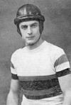 Man in a cycling suit wearing a leather helmet
