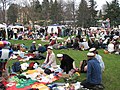 People having a Vappu picnic in Kaivopuisto.