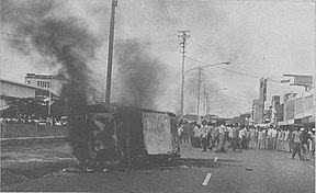 Photograph of a car being burned