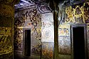 Cave 2 fresco above the right door shows Buddha in Tushita heaven[133]