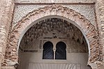 The decoration around the archway of the entrance iwan