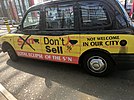 Black cab with Don't Sell The Sun messaging