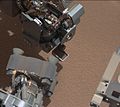 First use of the Curiosity rover scooper as it sifts a load of sand at "Rocknest" (October 7, 2012).