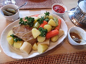 Pot-au-feu is a French dish of slowly boiled meat, typically beef, and vegetables.