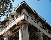 The entablature of the Hephaisteion in Athens, showing Doric frieze with triglyphs and sculpted metopes.