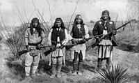 Geronimo, Yanozha (Geronimos's brother-in-law), Chappo (Geronimo's son by his second wife), and Fun (Yanozha's half brother) (right to left) in 1886.