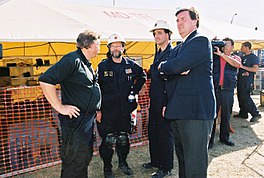 Arlington, Virginia, on September 12, 2001 — Members of the Federal Emergency Management Agency Urban Search and Rescue (U S & R) team from nearby Montgomery County, Maryland, talk with Doug Duncan, Montgomery County Executive, at the Pentagon