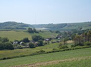The village of Gatcombe set within rolling chalk downland