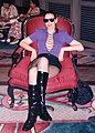 woman in black patent knee-length boots, 1996
