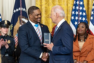 President Biden presents the Presidential Citizens Medal to Goodman during a ceremony on 6 January 2023 in the East Room of the White House.