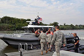Members of the New York National Guard join members of the New York State Naval Militia, the Port Authority Police Department and the Coast Guard Reserve.