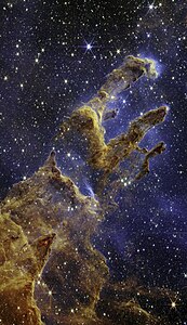 The Pillars of Creation are set off in a kaleidoscope of color in NASA’s James Webb Space Telescope’s near-infrared-light view. The pillars look like arches and spires rising out of a desert landscape, but are filled with semi-transparent gas and dust, and ever changing. This is a region where young stars are forming – or have barely burst from their dusty cocoons as they continue to form.