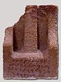 Stele with obelisk and inscription.