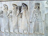 Relief from Persepolis (Iran) that represents people who carry bowls and amphoraes