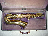 Conn 6M "Lady Face"[2] brass alto saxophone (dated 1935) in its original case