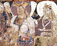 Probable Hepthalite rulers of Tokharistan, with single-lapel caftan and single-crescent crown, in the lateral row of dignitaries next to the Sun God.[37][38][33]