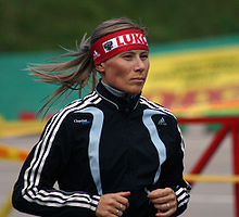 Yuliya Chepalova running in a track suit. She was later found guilty of doping in 2006.