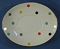 An oval plate with multiple polka dots colours
