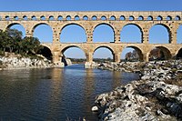 Pont du Gard seen from the river Gardon