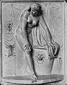 Woman climbing out of bath, plaster relief, n.d.