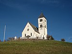 Pfarrkirche St. Wolfgang mit Friedhofskapelle und Friedhof in Radein