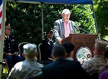 Man speaking at a ceremony