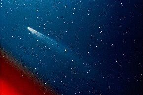 A color image of Comet Kohoutek, with its tail pointed towards the bottom right with the coma at top left
