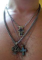 A man with three different cross necklaces