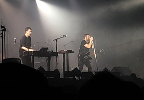 Atticus Ross (left) and Trent Reznor (right) performing in October 2018