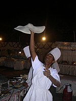A chef preparing manda roti