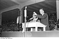 Billy Graham, a prominent evangelical revivalist, preaching in Duisburg, Germany in 1954