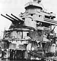 Damage to New Orleans with everything ahead of Turret No. 2 missing after being hit by a single torpedo that detonated her forward magazines. Photographed after the Battle of Tassafaronga, which occurred on 30 November 1942.