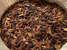 Ready rubbed pipe tobacco inside a round 100g tin