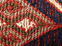 Detail of weft wrapping: "weft yarns .. can be pushed about as the weaver wishes"[4]