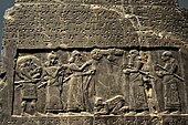The Black Obelisk of Shalmaneser III. The king, surrounded by his royal attendants and a high-ranking official, receives a tribute from Sua, king of Gilzanu (north-west Iran), who bows and prostrates before the king. From Nimrud