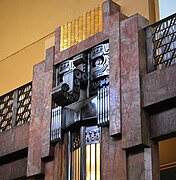 A pillar featuring the Maya rain god Chaac in the Art Deco interior of the Palacio de Bellas Artes, Mexico City.