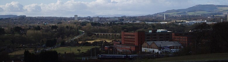 View looking towards Glenrothes from elevated site at St Drostan's Cemetary near Markinch with a view of the town centre skyline, approach roads and railway viaducts