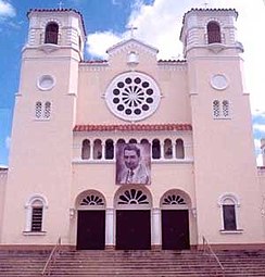 Caguas cathedral 'Dulce Nombre de Jesús' founded in 1729. On the facade hangs an image of native son Blessed Carlos Manuel Rodríguez, whose body rests in the cathedral.