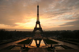 The Eiffel Tower silhouetted by a sunrise.
