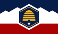 The flag of Utah, a horizontal triband charged with a beehive.