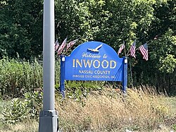 An Inwood welcome sign on the Nassau Expressway in August 2022.