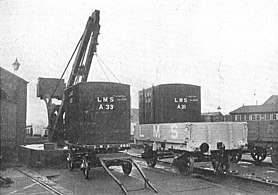 Transferring freight containers on the London, Midland and Scottish Railway (LMS; 1928)