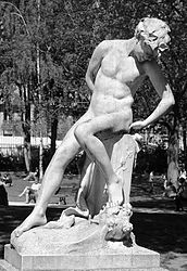 Statue in Paris park (Parc Monceau) "Le Jeune Faune" by Félix Charpentier