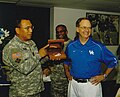 Bryant in September 2005, presenting University of Kentucky President Lee Todd Jr. with an award.