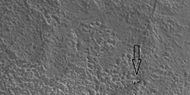 Out of place rock, as seen by HiRISE under HiWish program The arrow points to a large rock that is definitely out of place. It may be a meteorite or it may have been tossed here by a nearby impact.