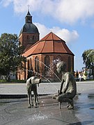 Market place in Ribnitz with Saint Mary's church and fountain