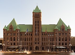 The station's design preserves the view of Minneapolis City Hall, an ornate Richardsonian Romanesque design.