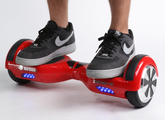 A self-balancing scooter. These devices (also named hoverboards at the time) attracted much attention and curiosity around 2015 on the Internet from appearing on shows such as Jimmy Fallon and Conan.